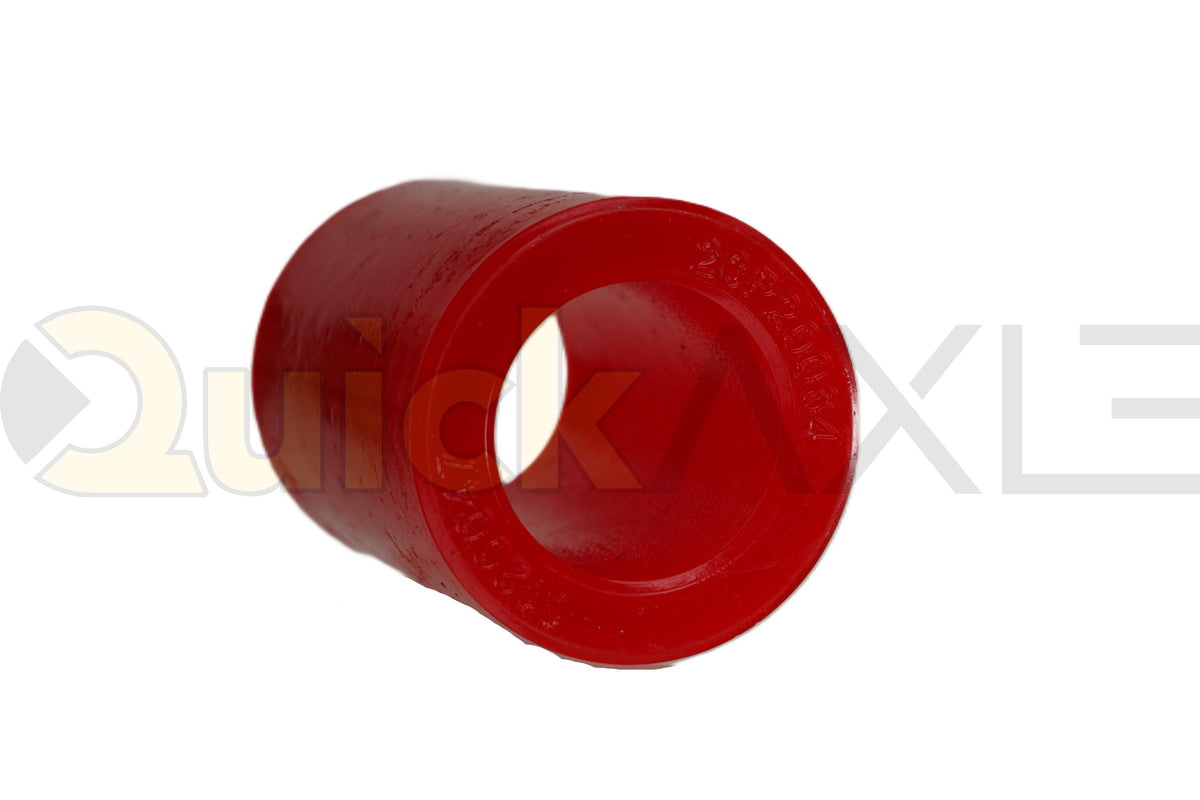 Red cylindrical suspension bushing showing its hollow center.