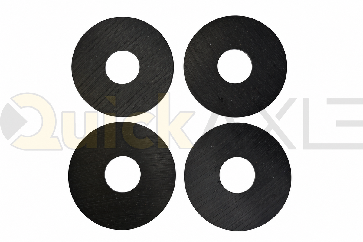 Flat black circular wear washers showing their central openings.