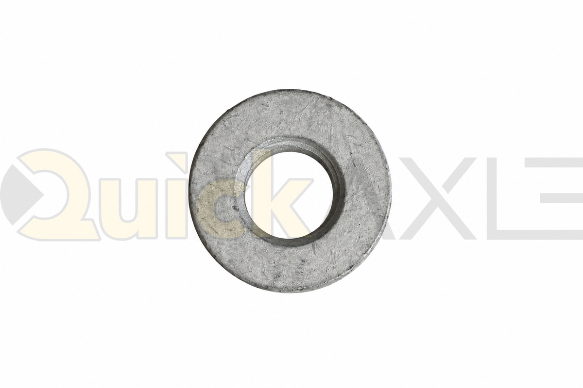 Flat washers arranged to show their central openings and stamped markings.
